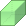 A green block positioned at an angle, illustrating geometric shapes and dimensions.